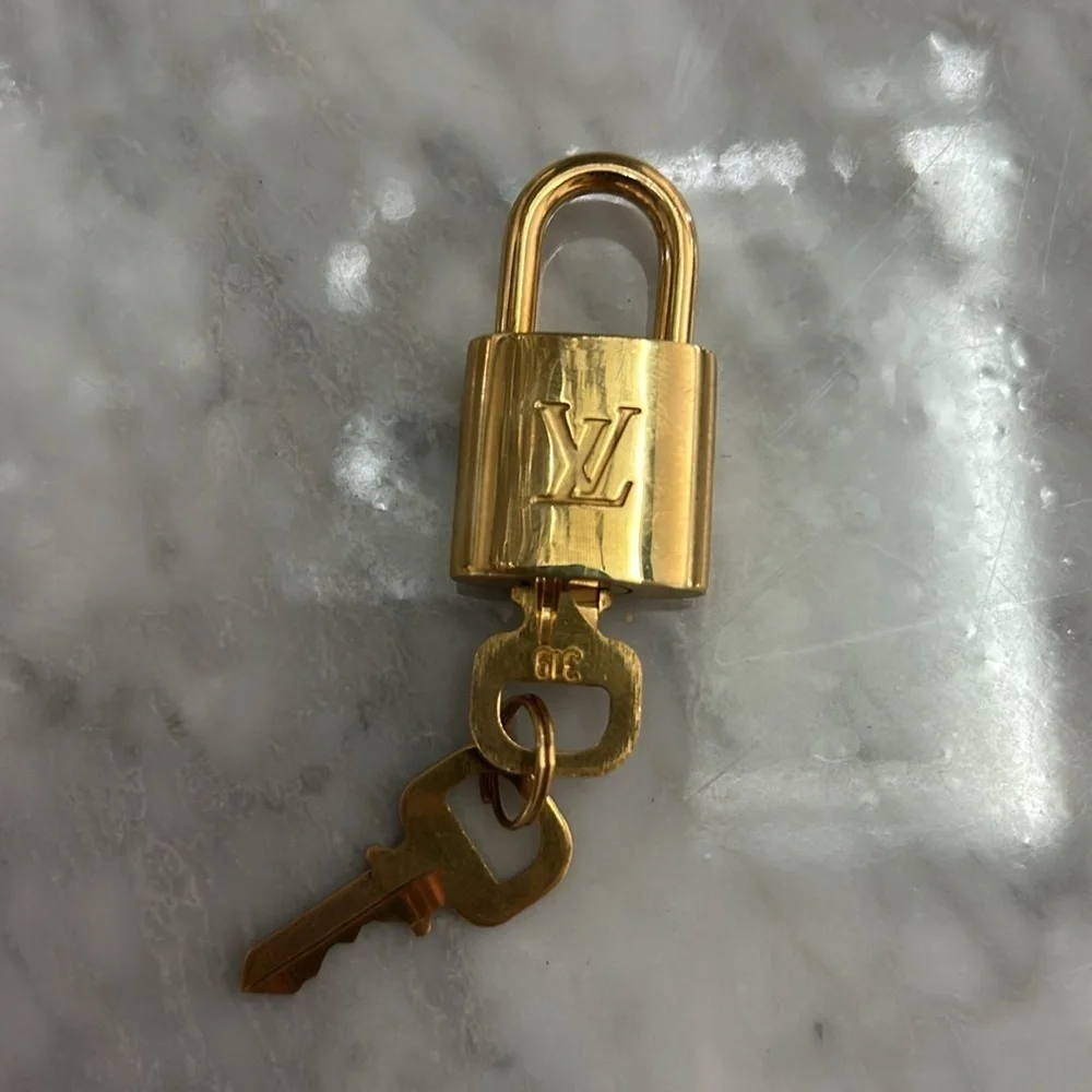 Louis Vuitton Gold Padlock and Key Set